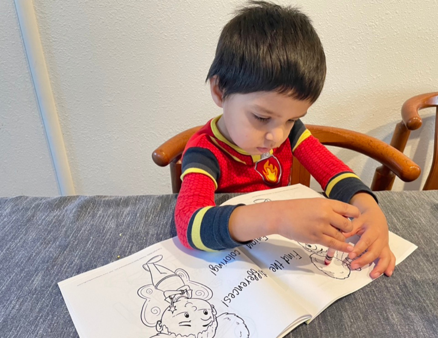 Boy coloring in book