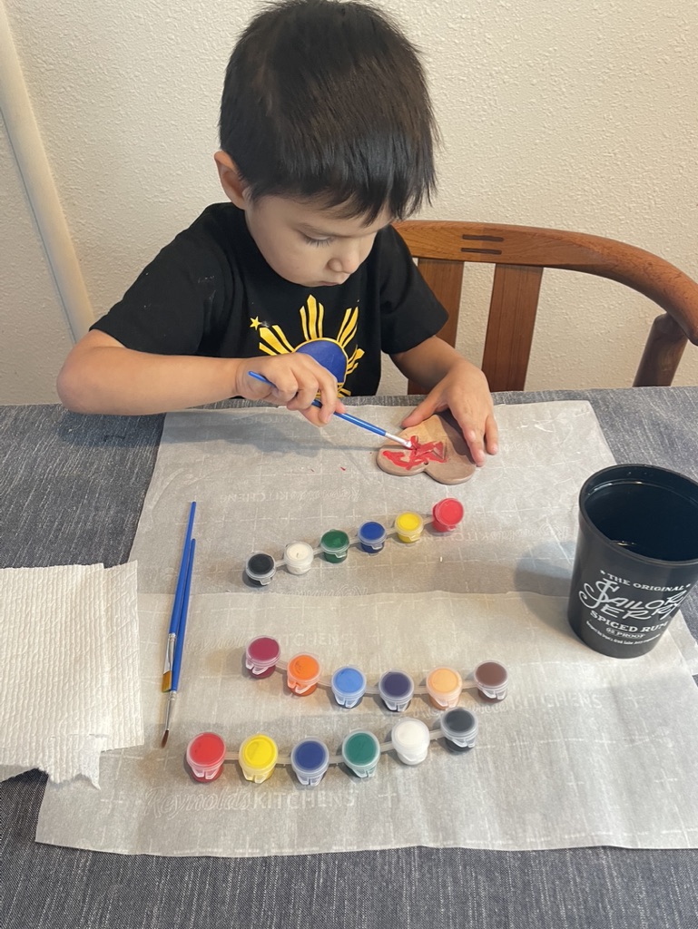 Boy painting Clay