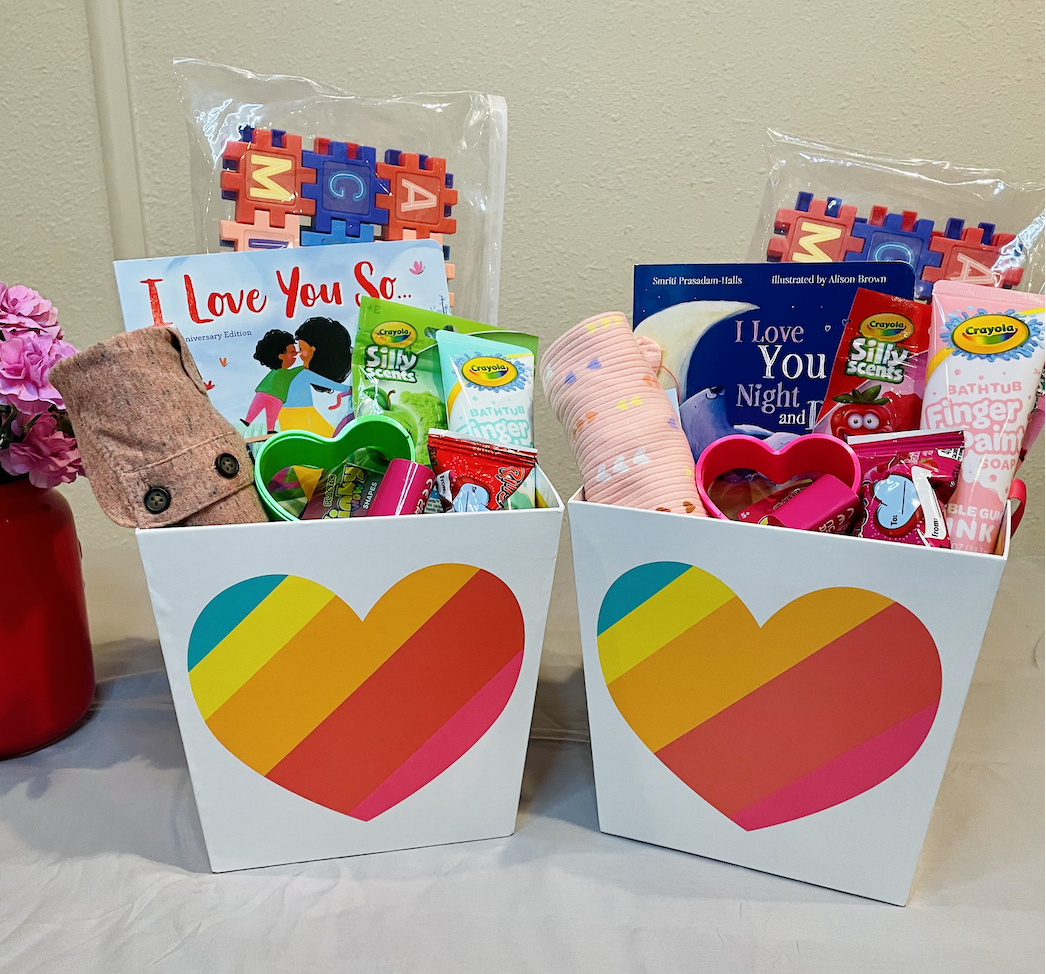 Two baskets with hearts filled with Valentine's Day gifts